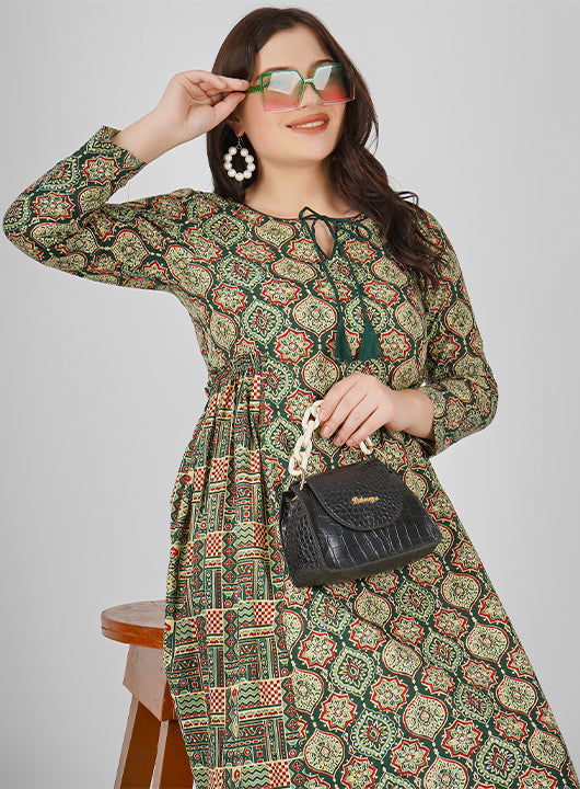 Embrace the beauty of summer with this Cotton Floral Print Dress, featuring a charming dori tie neckline and side pleated detailing for a flattering silhouette.