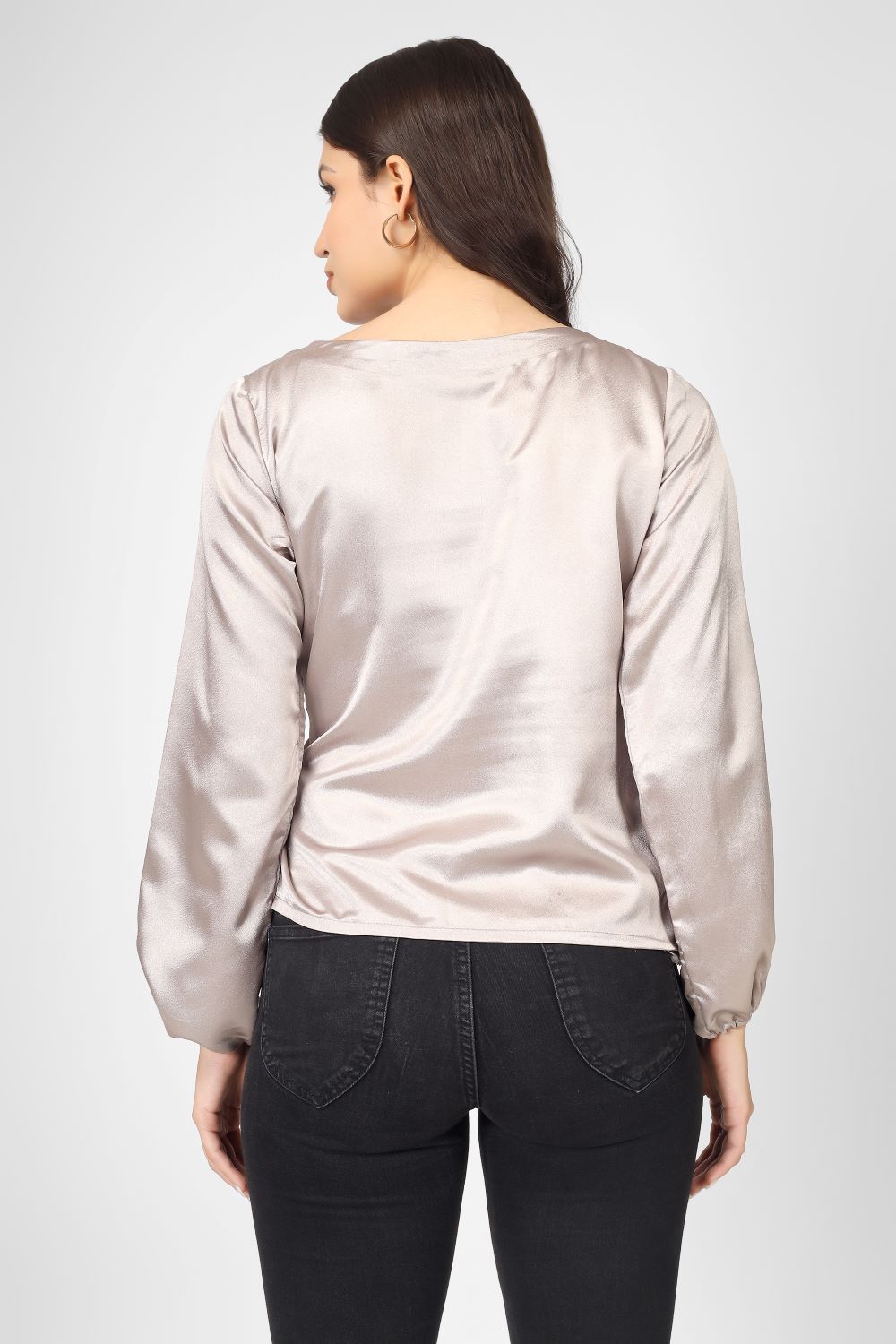 Elevate your look with this plain overlap satin top featuring full sleeves, a stylish tie knot, and neat piping detailing.