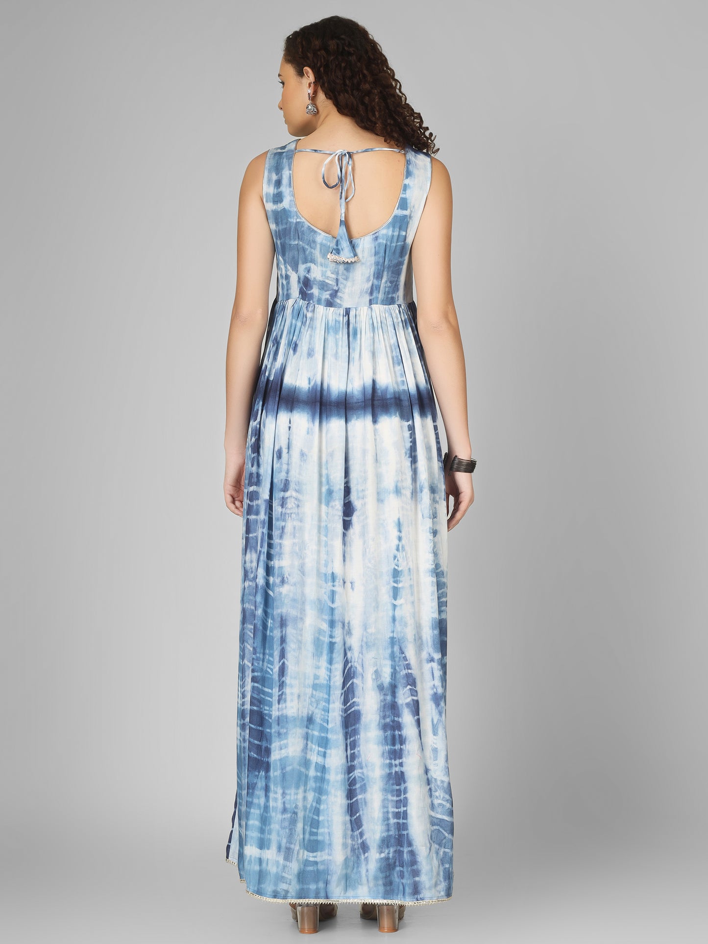 This long tie-dye blue dress is a stunning choice for the festive season. Crafted from soft, flowy fabric,