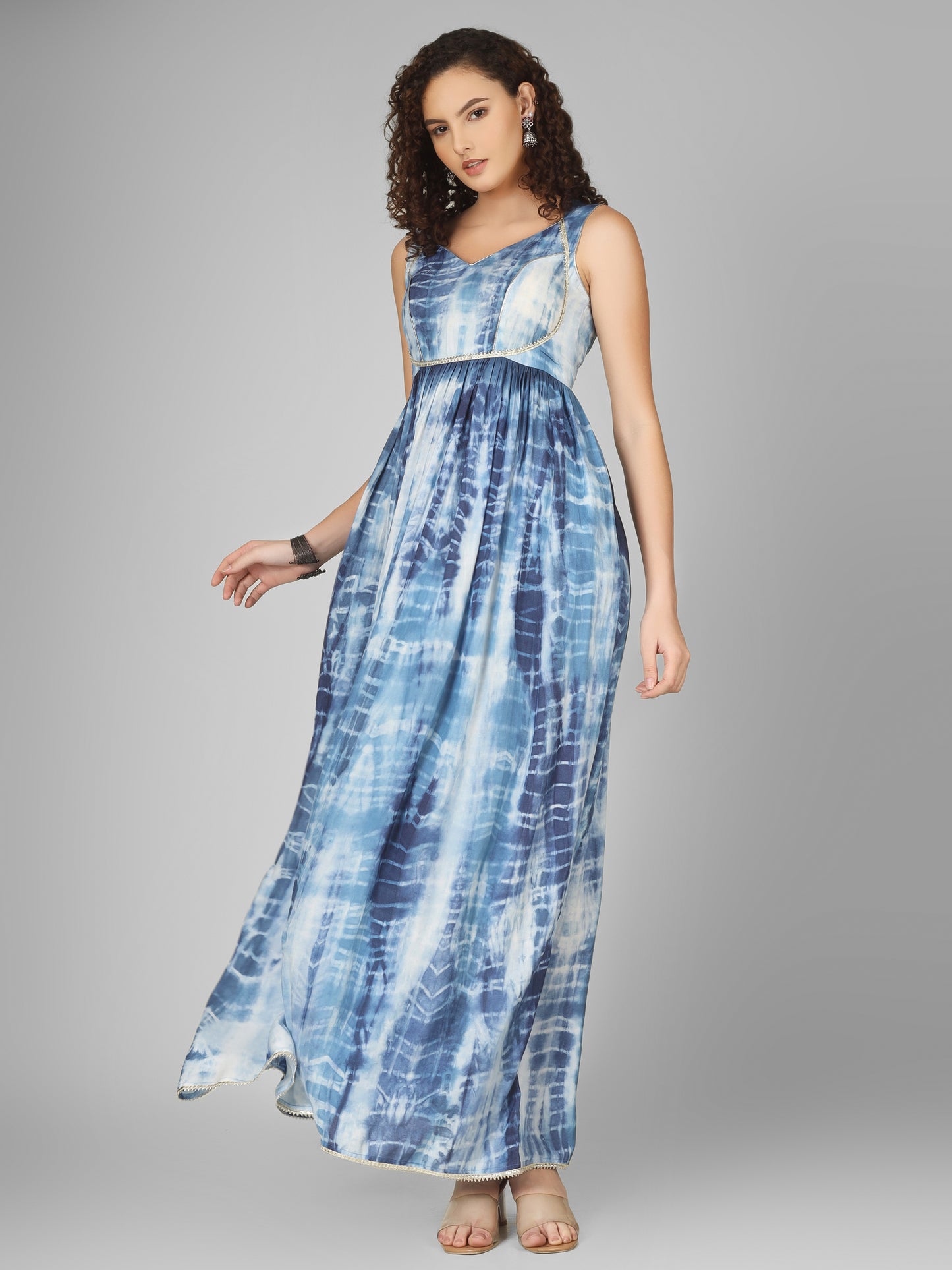 This long tie-dye blue dress is a stunning choice for the festive season. Crafted from soft, flowy fabric,