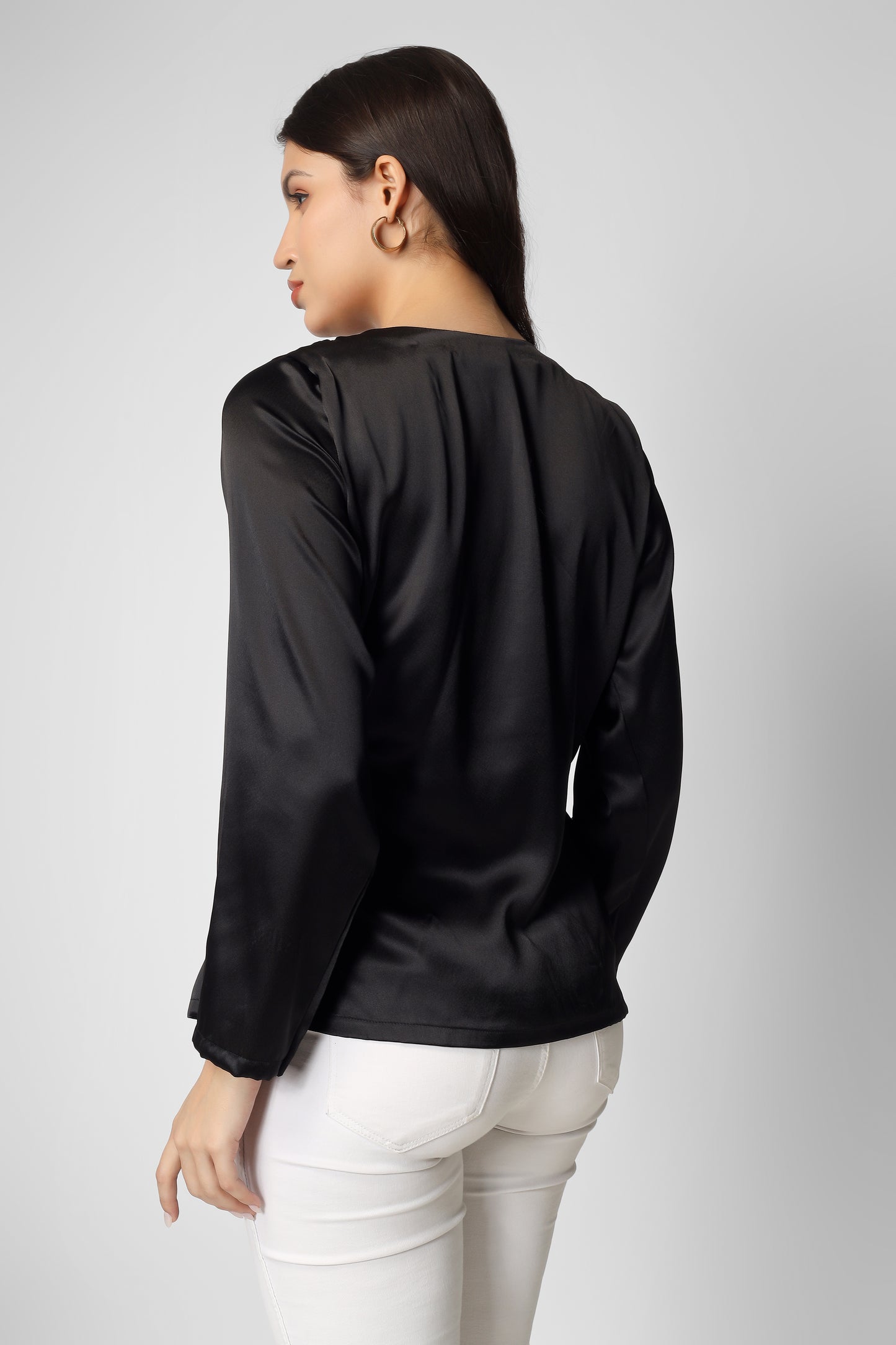This plain black satin overlap top with full sleeves is the perfect mix of elegance and modern style.