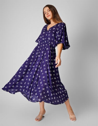 Elevate your style with this Blue Printed Cotton Flared Dress, featuring graceful umbrella sleeves that add a touch of charm and movement.