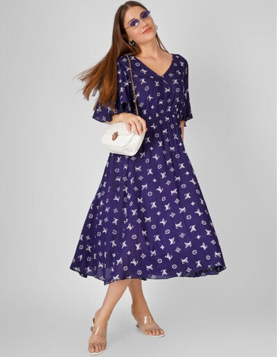 Elevate your style with this Blue Printed Cotton Flared Dress, featuring graceful umbrella sleeves that add a touch of charm and movement.