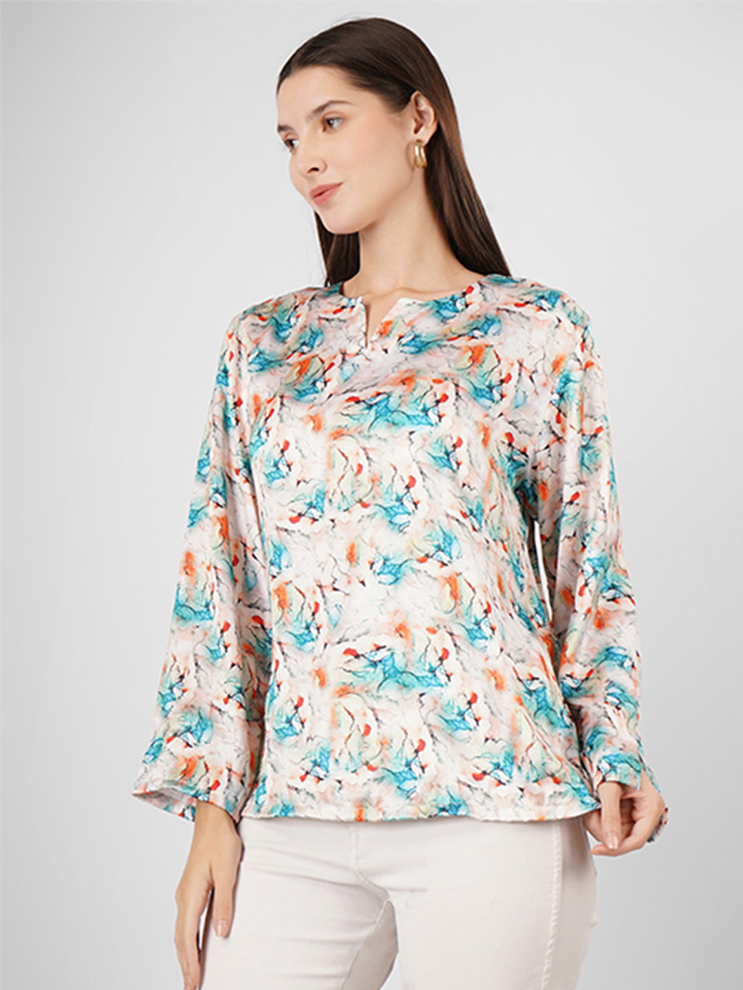 This V-neck printed satin top with full sleeves is the perfect blend of style and versatility