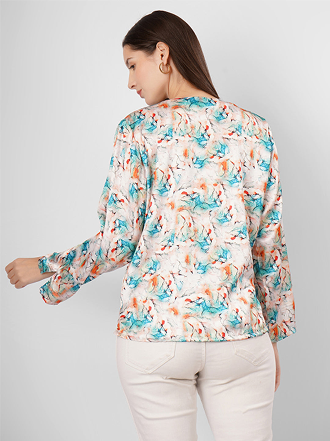 This V-neck printed satin top with full sleeves is the perfect blend of style and versatility