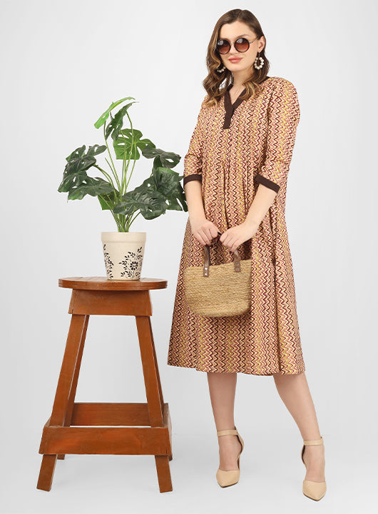This cotton fit and flare dress is a perfect blend of style and comfort, ideal for summer parties or workwear.
