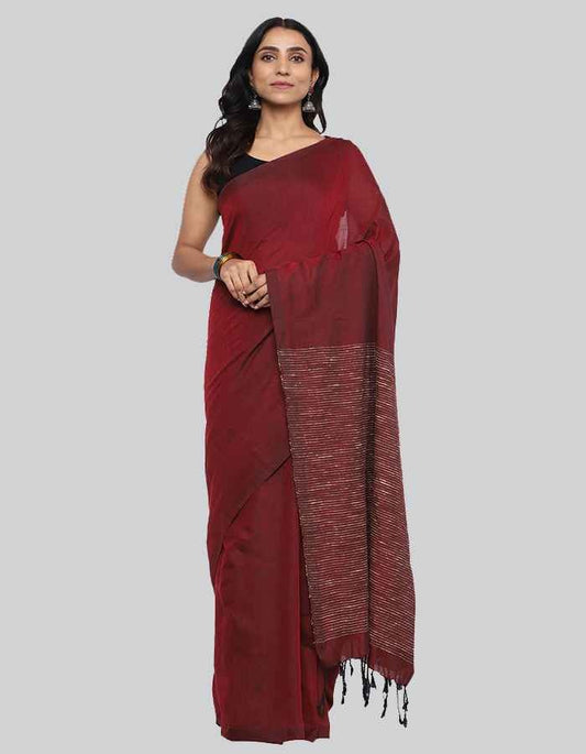 Maroon Linen saree with same blouse and strip and tessle on pallu is perfect workwear and party wear