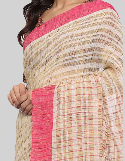 Offwhite saree with pink border and slub texture is perfect workwear and evening wear.