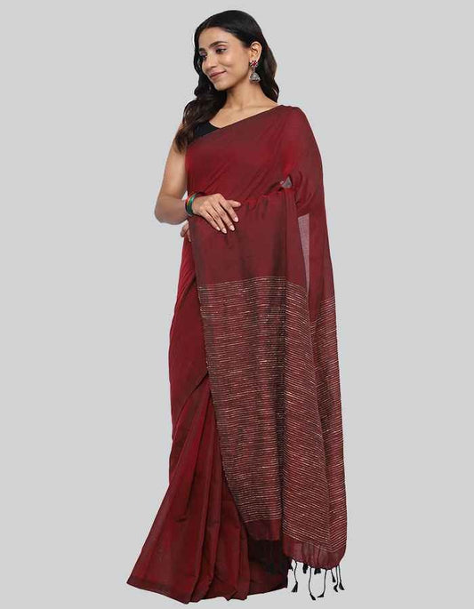 Maroon Linen saree with same blouse and strip and tessle on pallu is perfect workwear and party wear