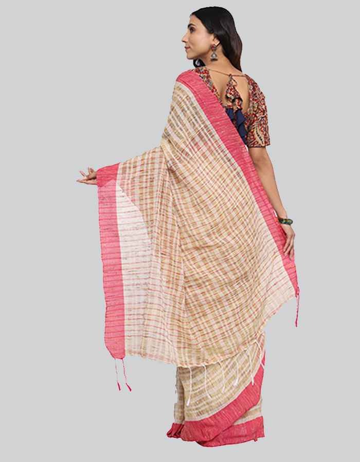 Offwhite saree with pink border and slub texture is perfect workwear and evening wear.