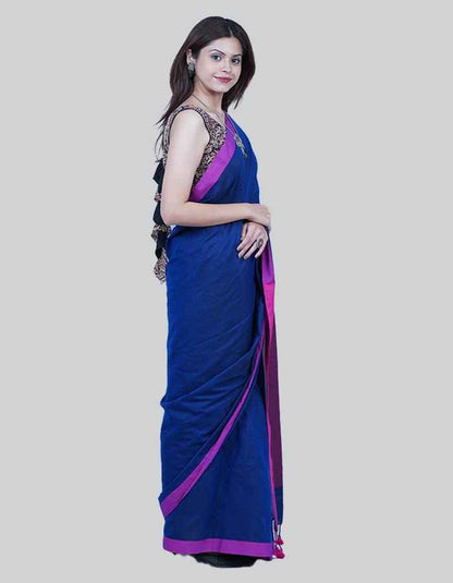 Linen purple saree with Magenda pink pallu and teseels on the pallu