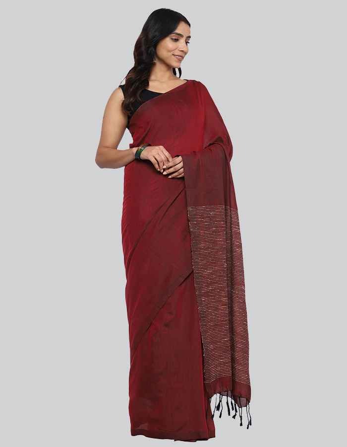 Maroon Linen saree with same blouse and strip and tessle on pallu is perfect workwear and party wear